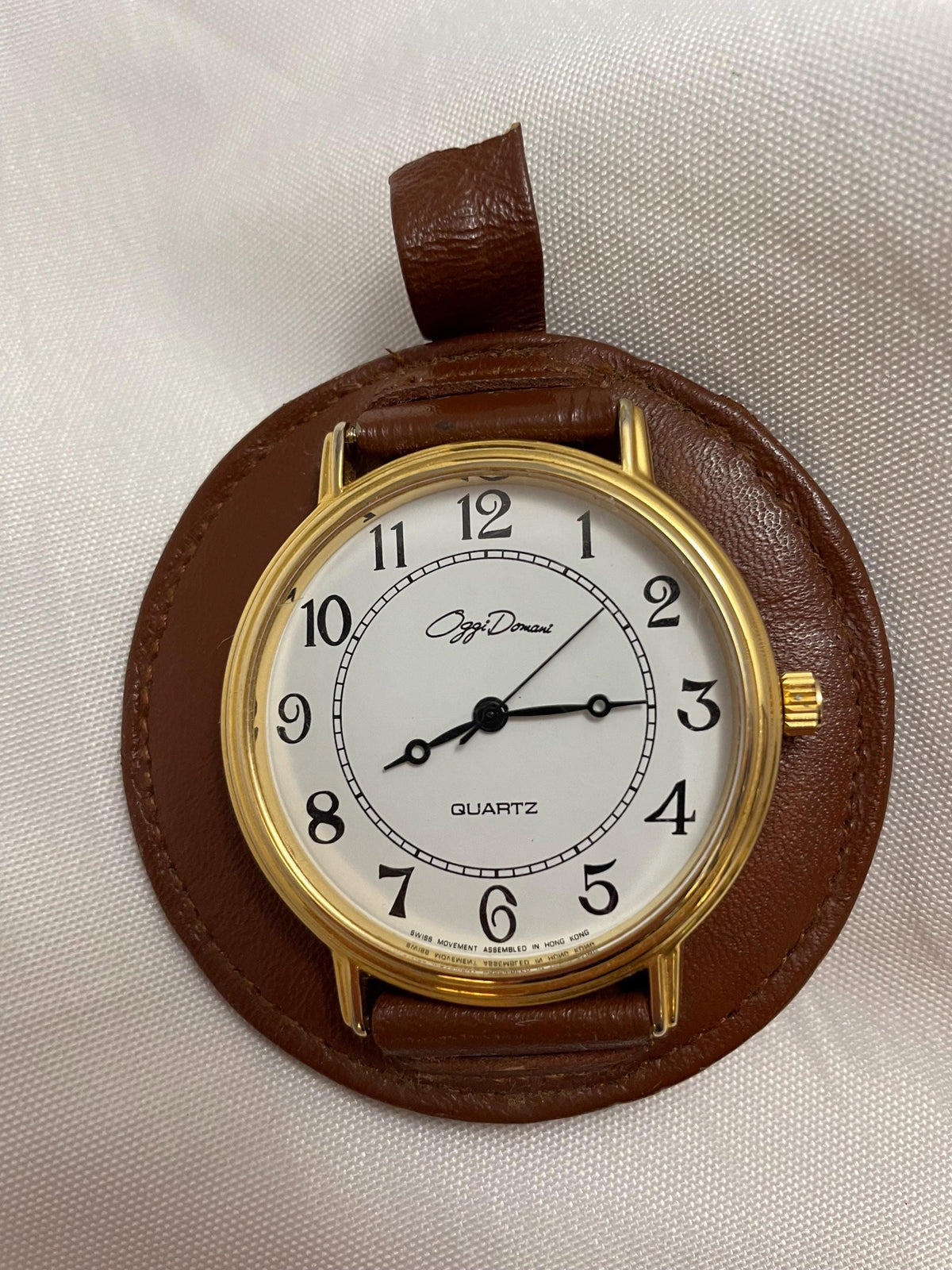 Vintage Oggi Domani Accessory wrist watch. gold. Genuine Cowhide Leather mounted. unable to determine if it works.