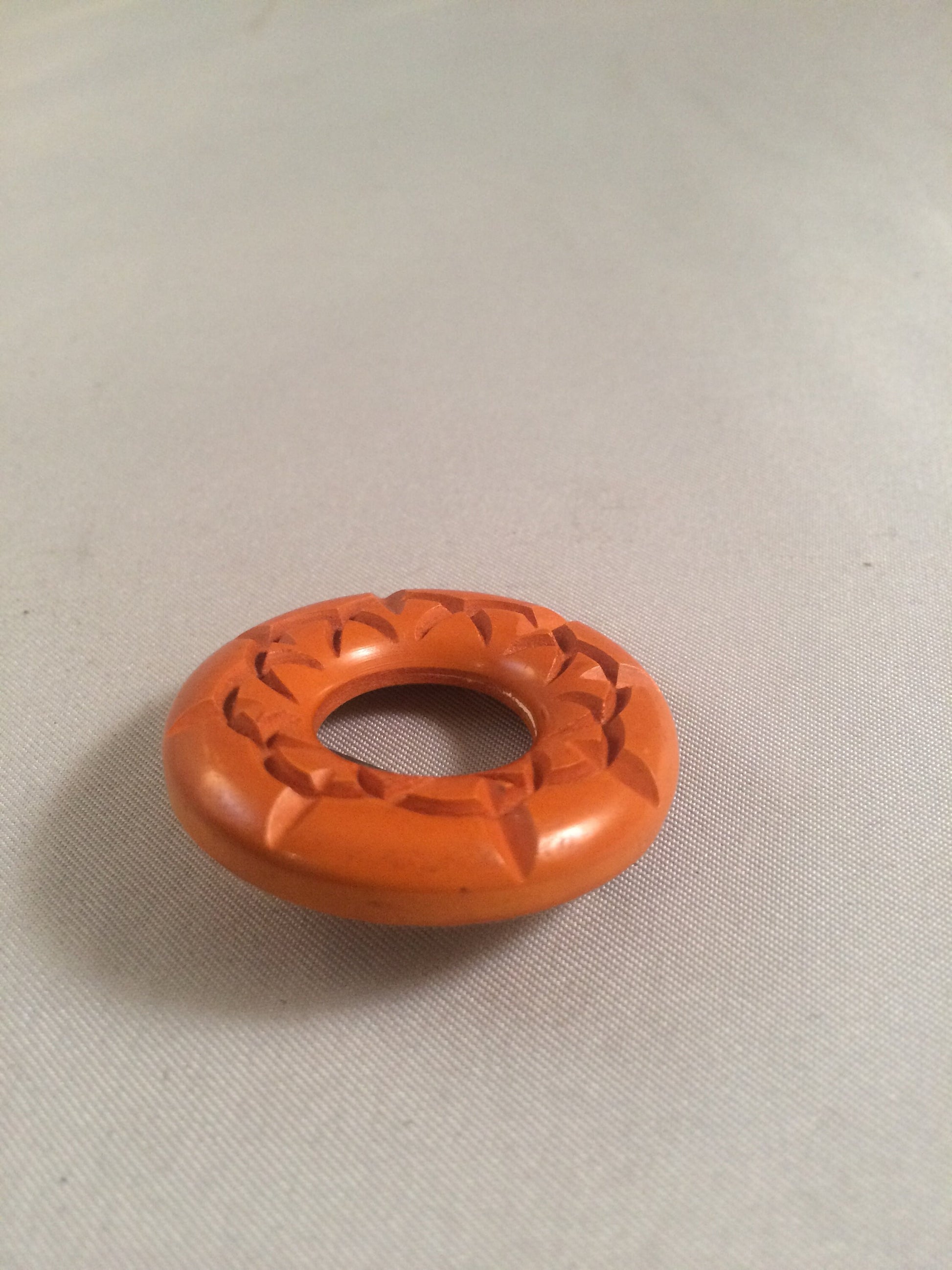 Bakelite Catalin Orange Carved Circle Brooch