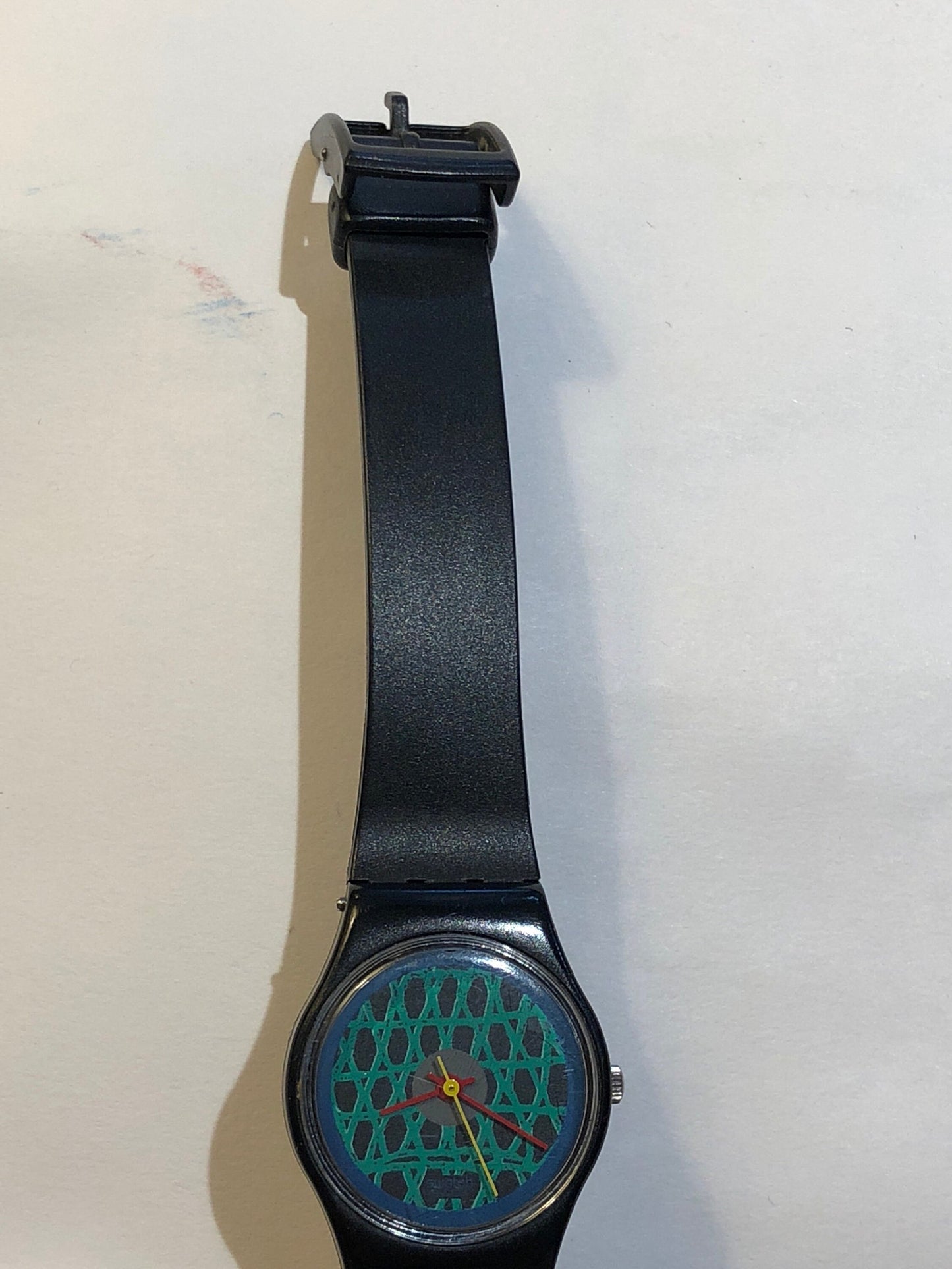 Vintage 1980s Swatch With A Green Net Design, Red & Yellow Minute/Hour hands.