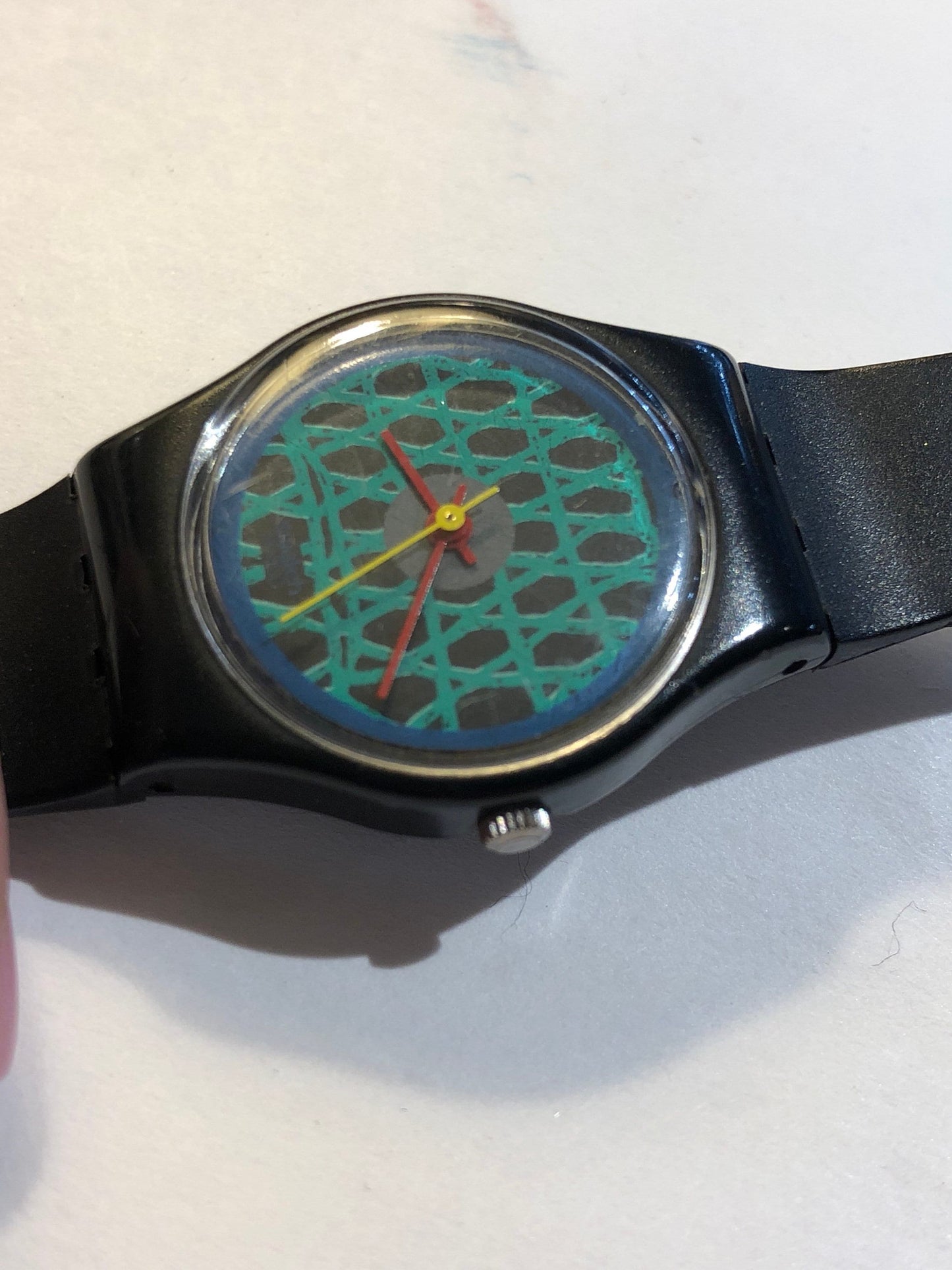 Vintage 1980s Swatch With A Green Net Design, Red & Yellow Minute/Hour hands.