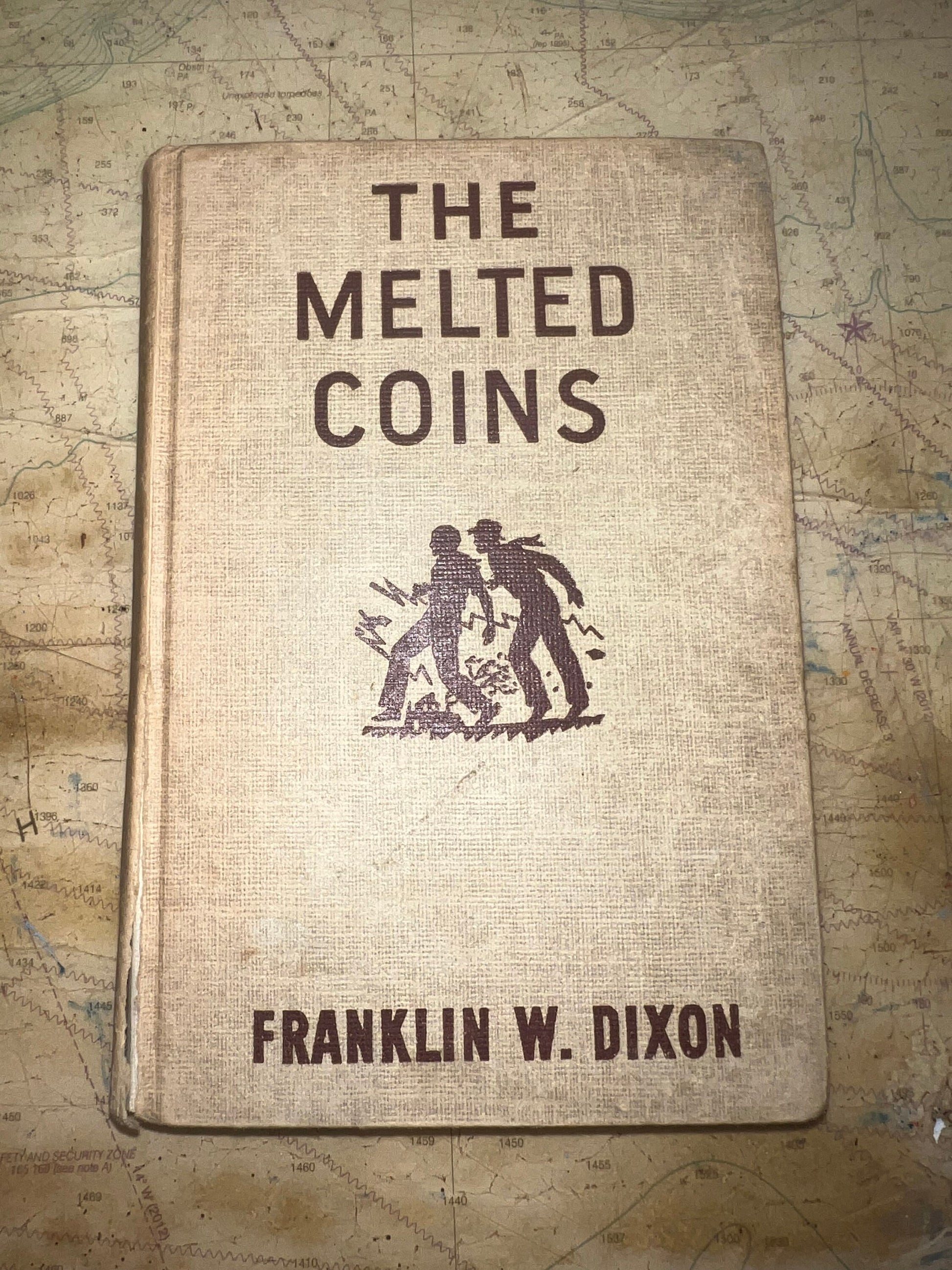 The Melted Coins by Franklin W. Dixon