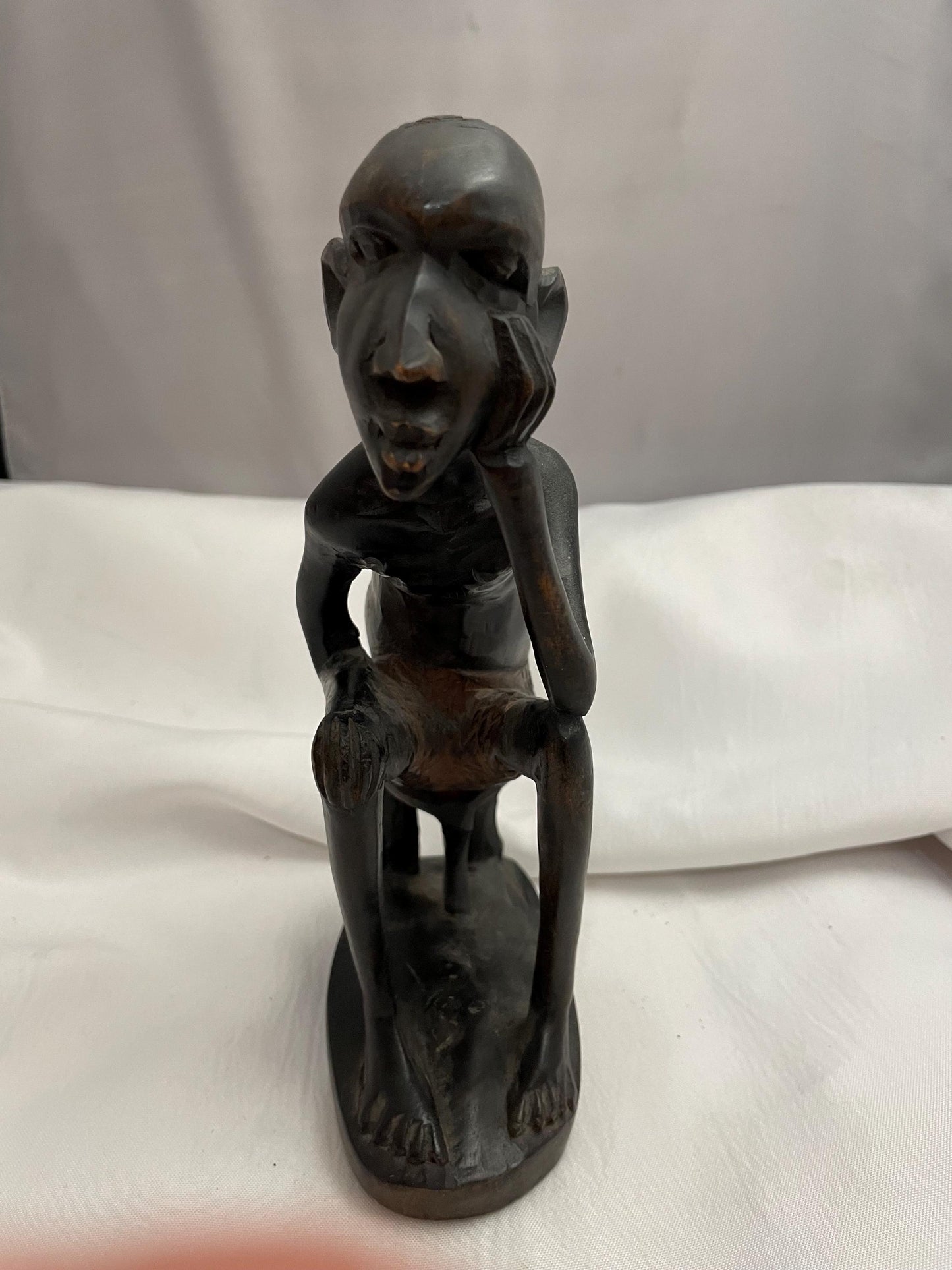 african Handcarved sitting Man