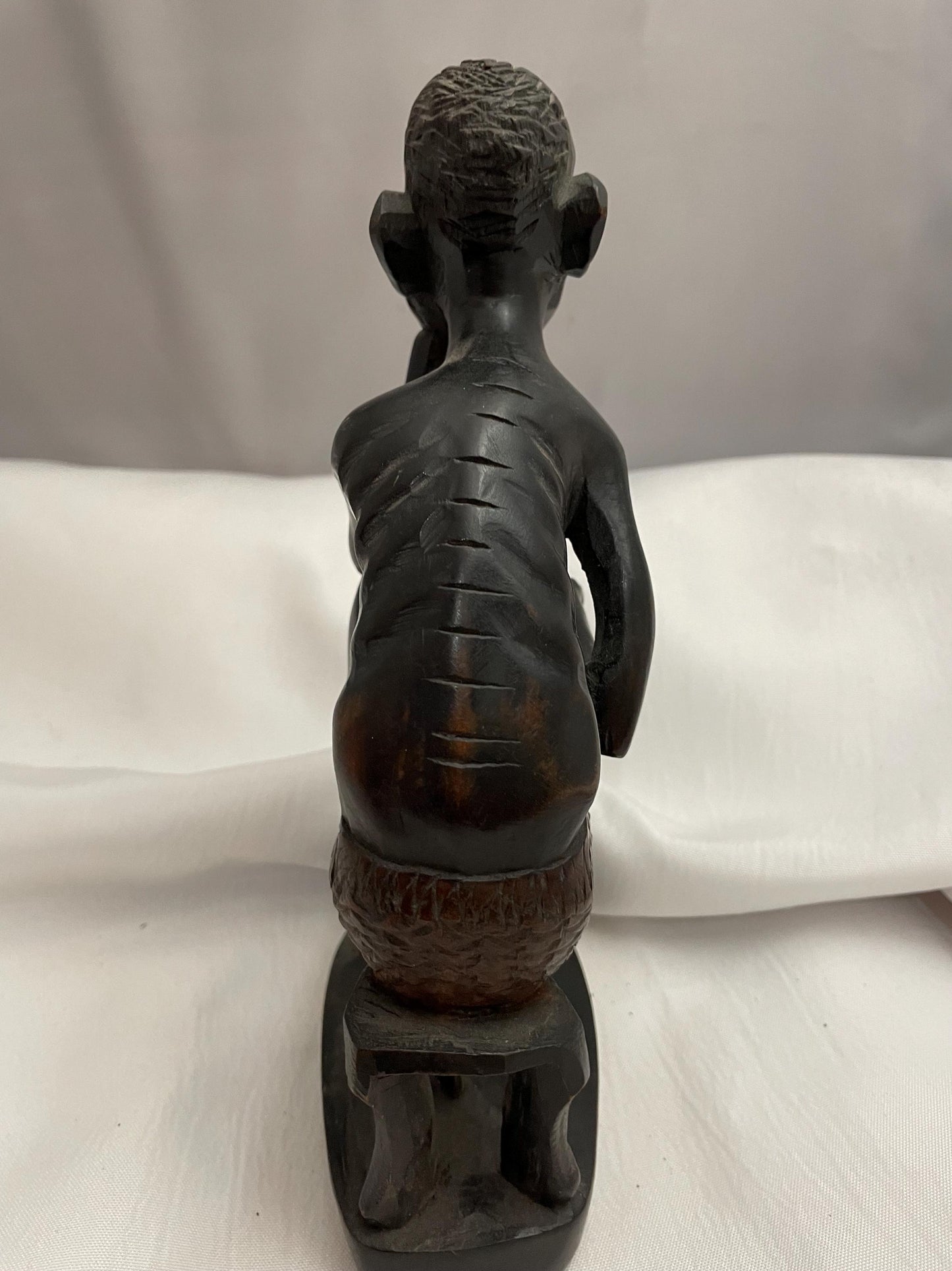 african Handcarved sitting Man