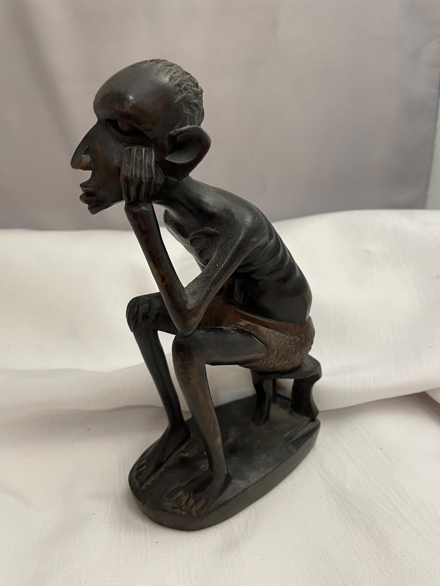 african Handcarved sitting Man