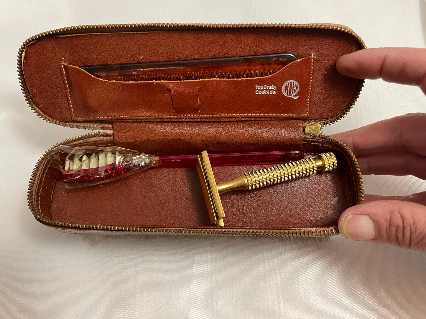 Vintage Theodore C. Salomon clothes/shoe brush W/ grooming accessories Leather zipped compartment.