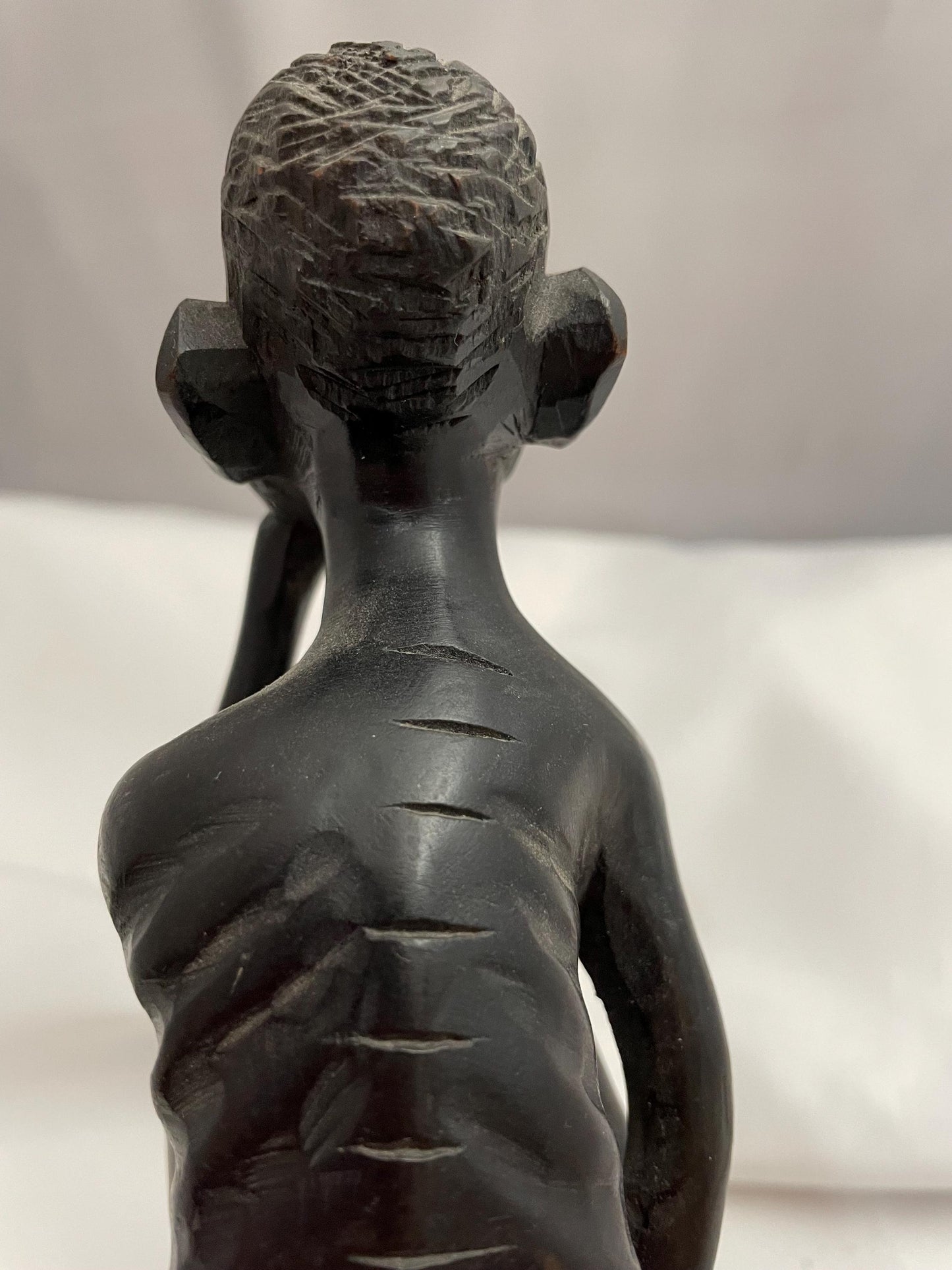 african Handcarved sitting Man