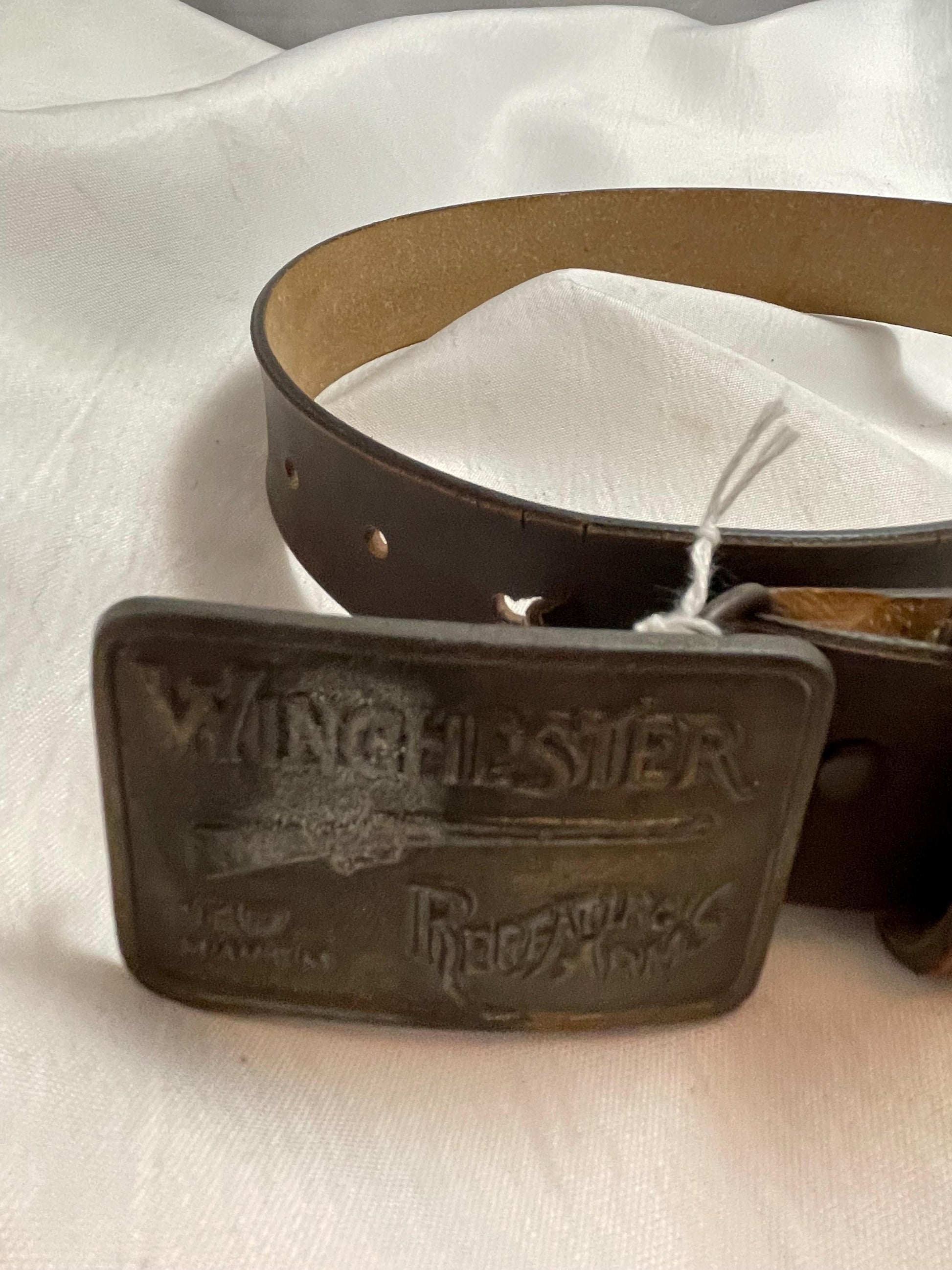 Winchester Repeating Firearms Firearms Belt Buckle. Small Leather belt.