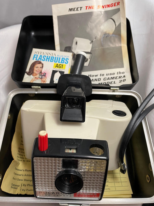 Vintage Polaroid Swinger model 20 Land camera w/ case, instructions and extra flashbulbs.