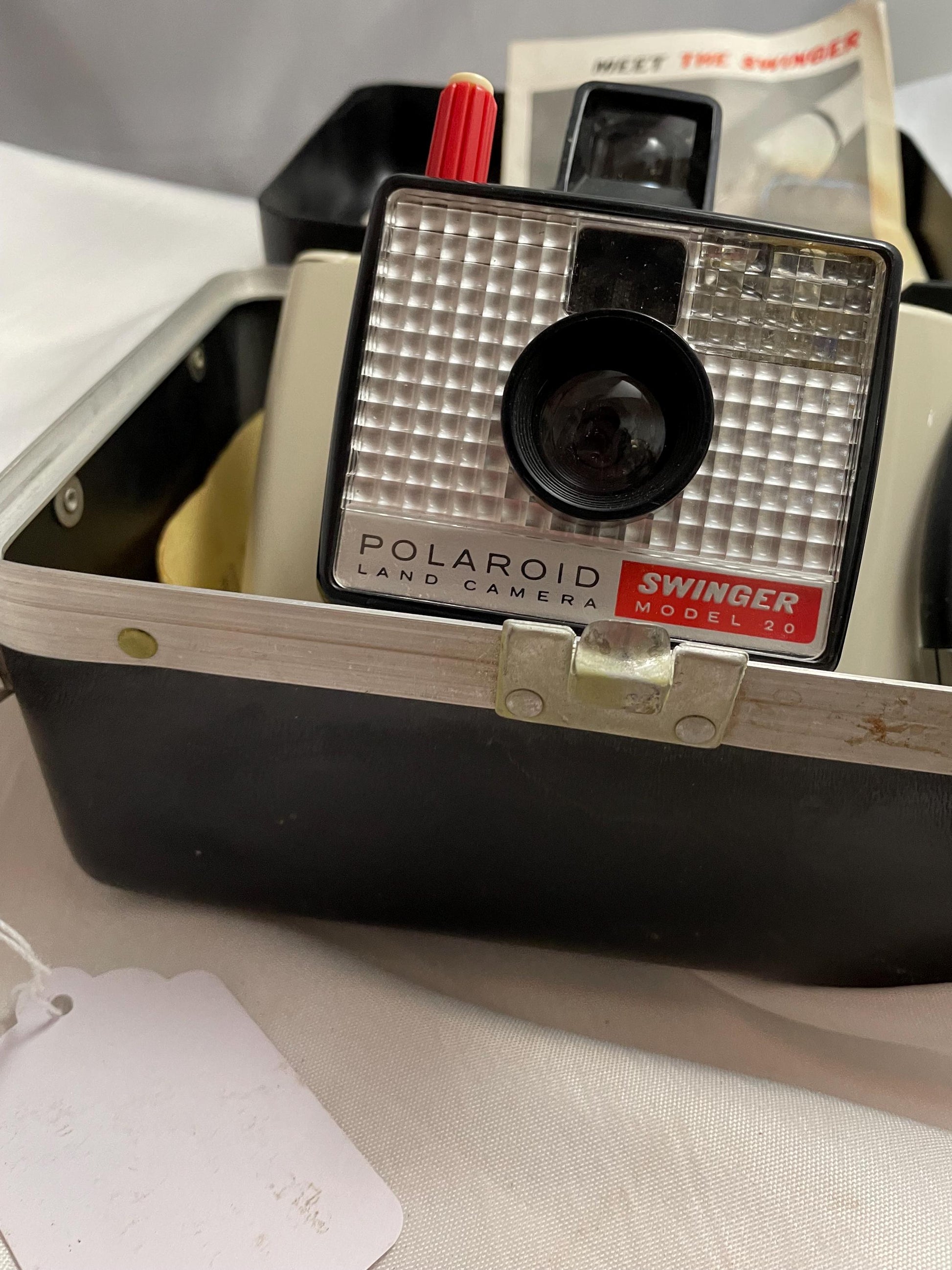 Vintage Polaroid Swinger model 20 Land camera w/ case, instructions and extra flashbulbs.