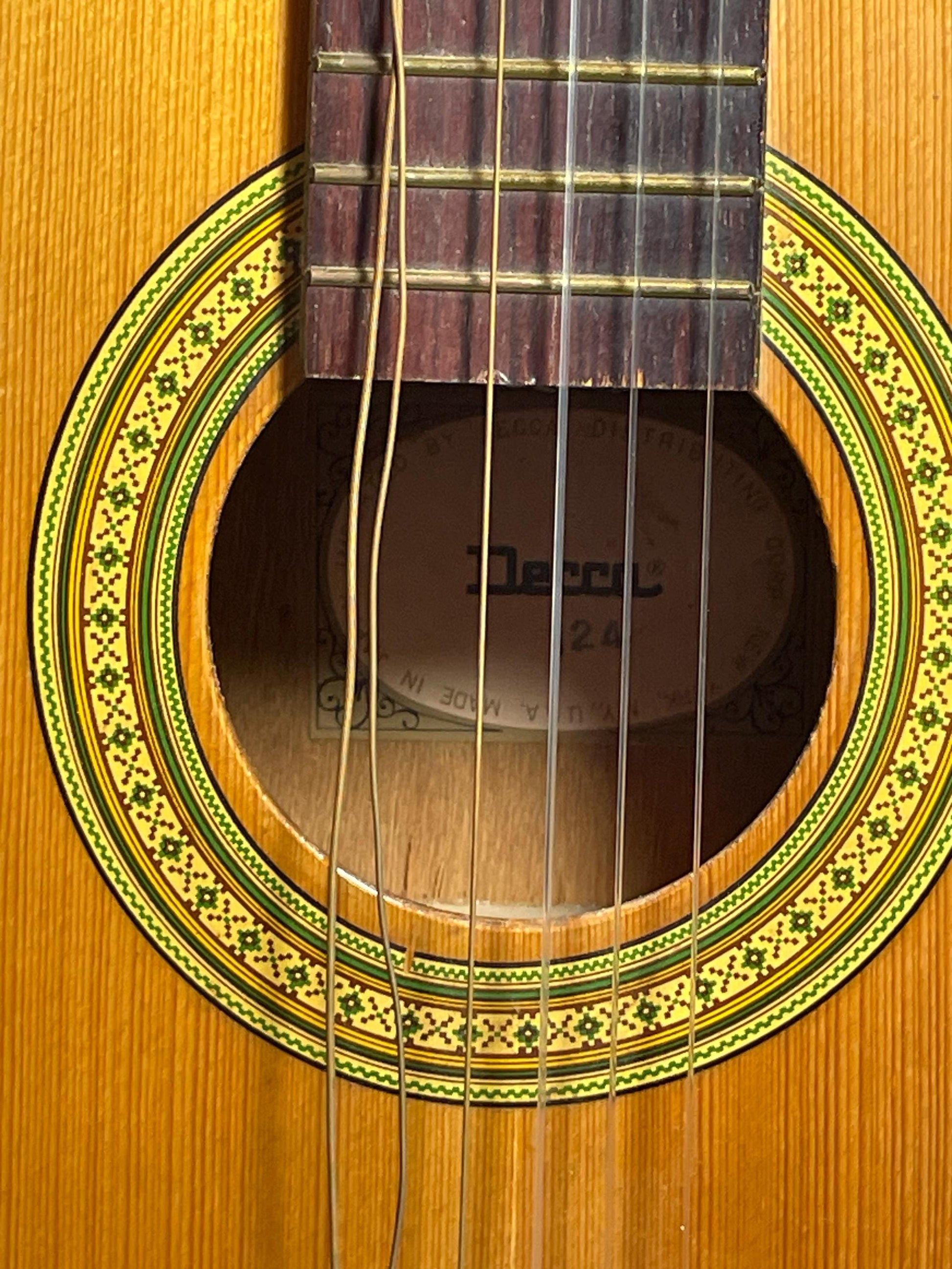 Decca Acoustic 124 Guitar w/ case. Back wood at bottom is cracked.