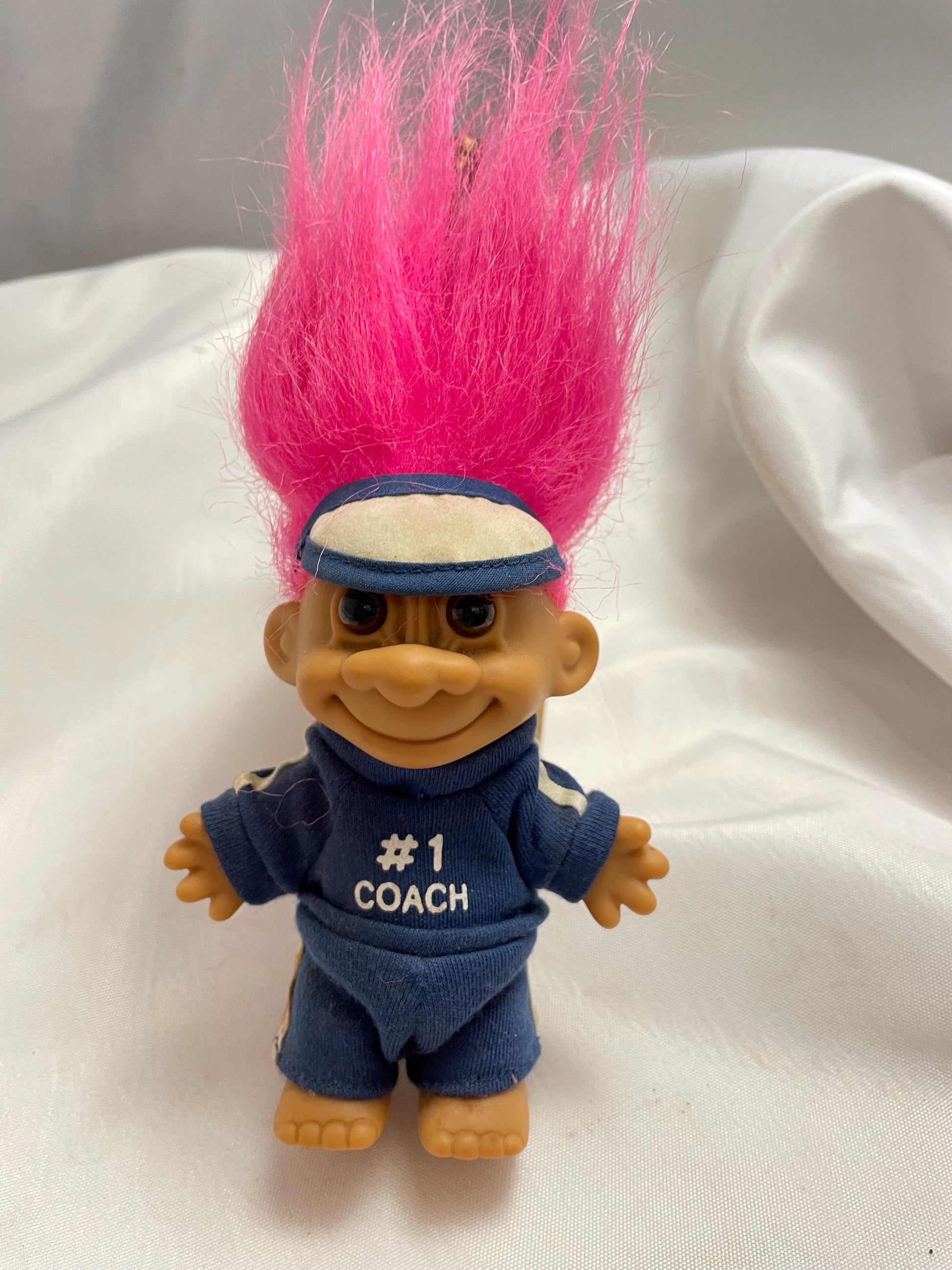 Russ Berrie #1 Coach w/track suit Troll Doll. Pink hair. 4 1/2”.