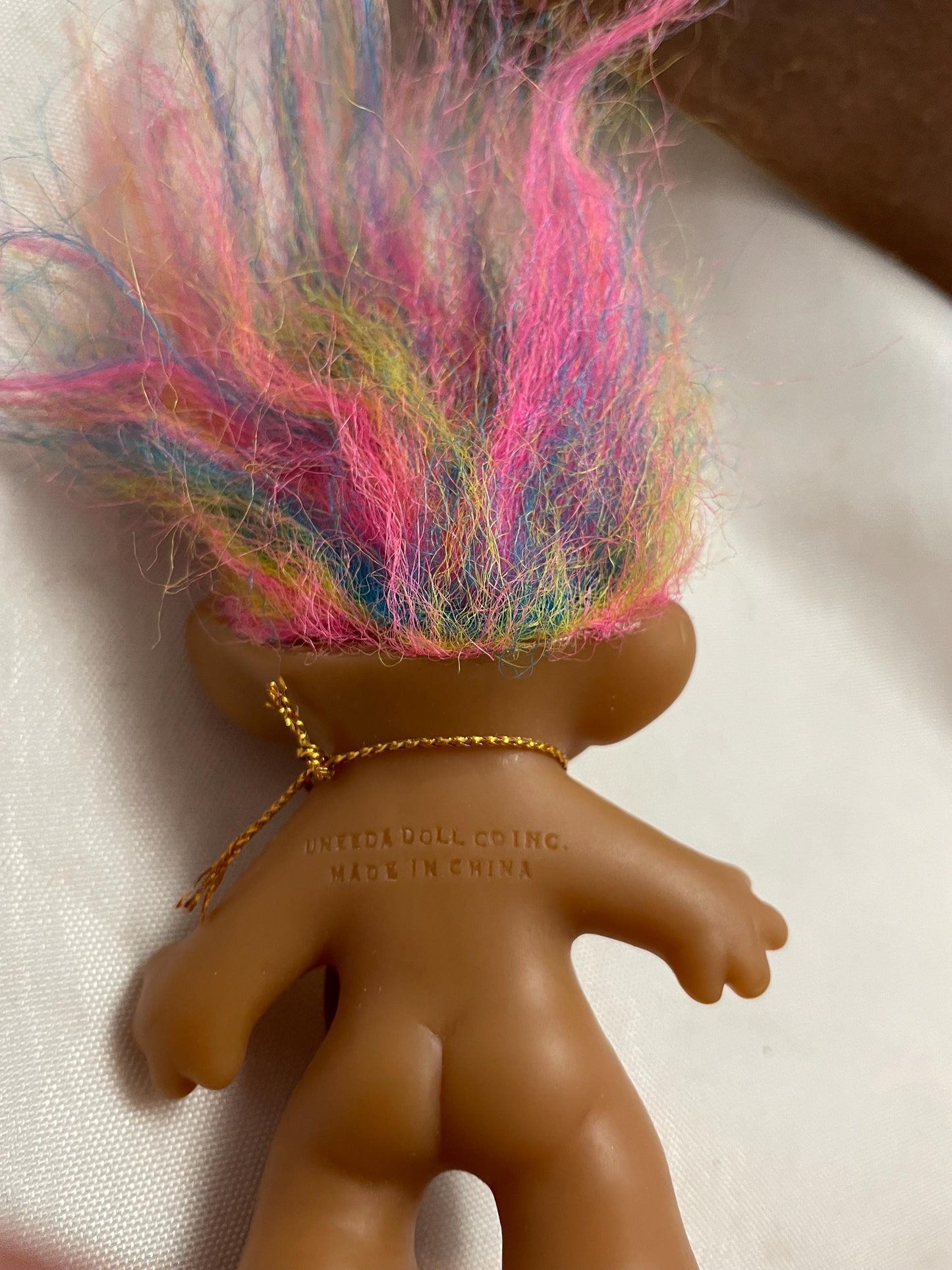 Vintage Uneeda Good Luck Wishnik Troll doll. 21/2”. Rainbow hair.