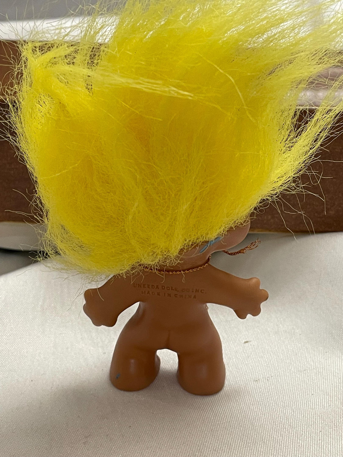 Vintage Russ Troll doll w/ Yellow hair. 3 1/2”.