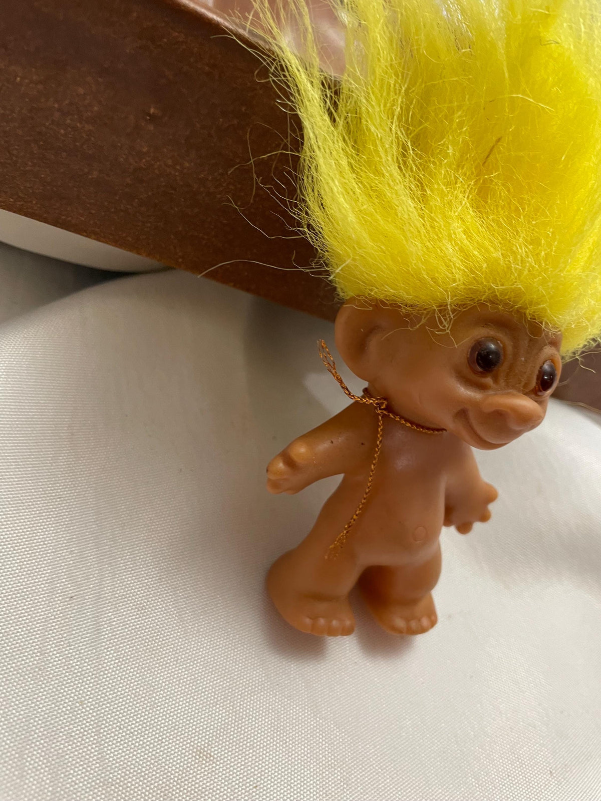 Vintage Russ Troll doll w/ Yellow hair. 3 1/2”.
