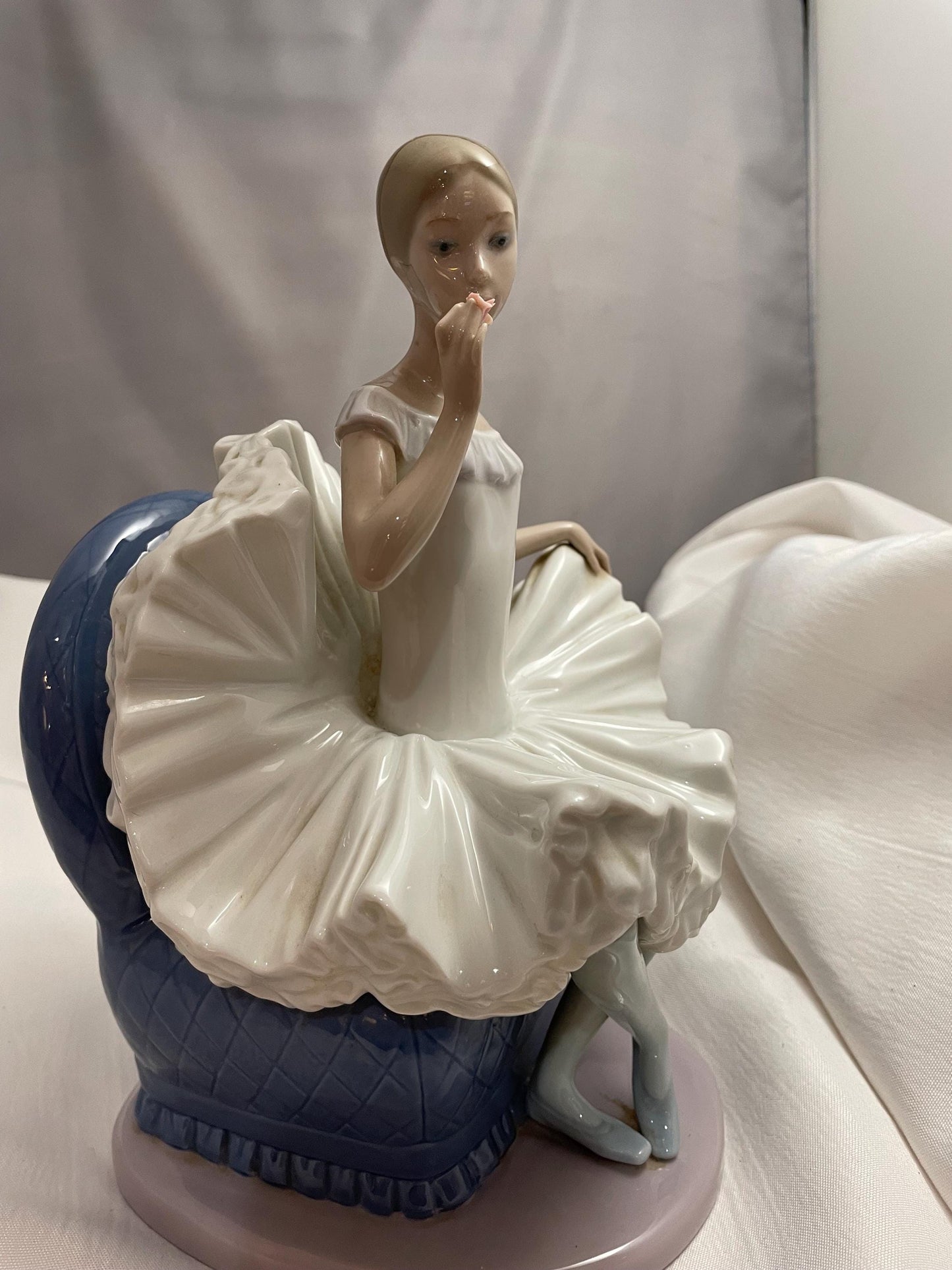 1983 Large Porcelain Lladro sitting Ballerina/Blue chair.