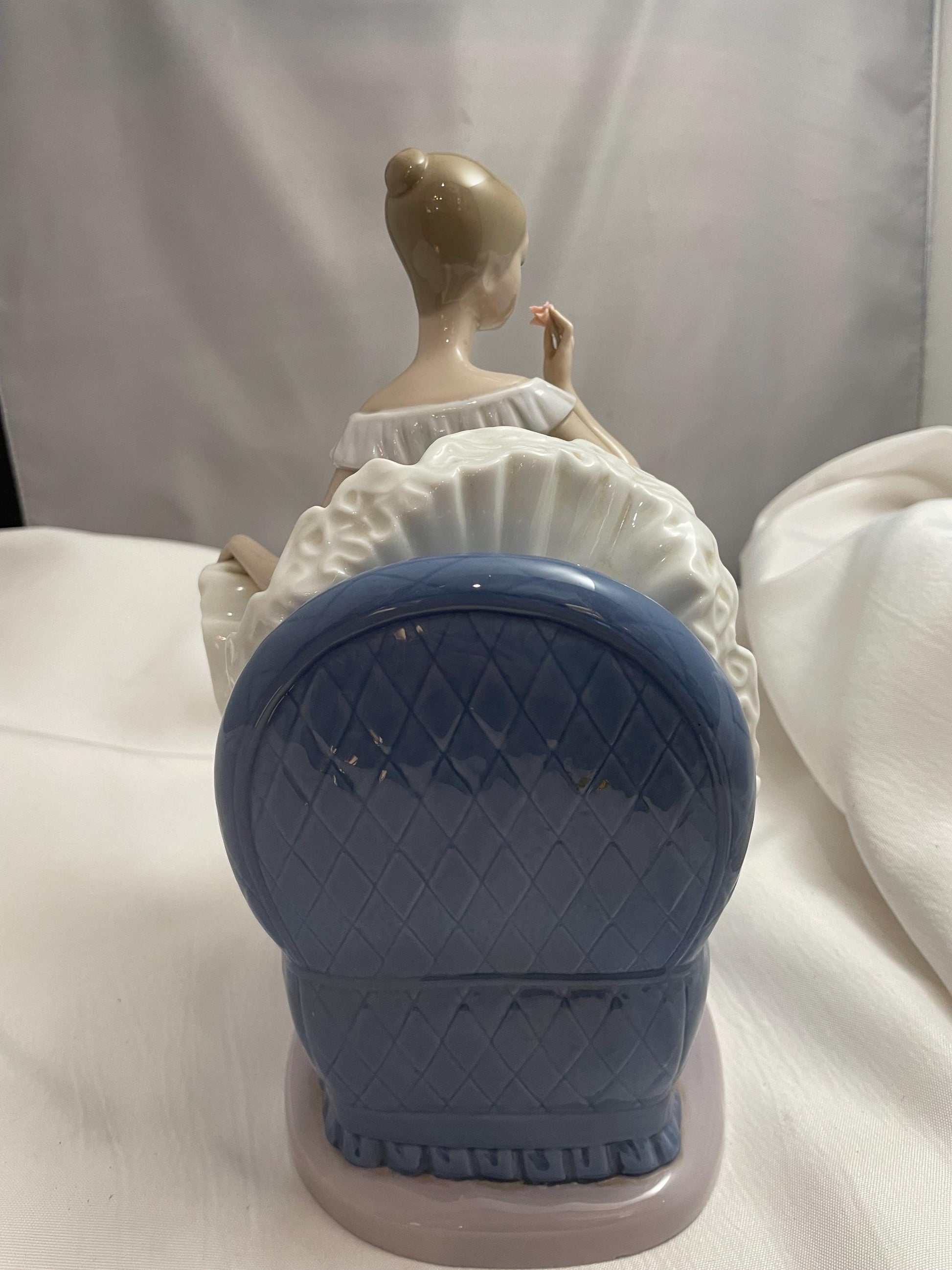1983 Large Porcelain Lladro sitting Ballerina/Blue chair.
