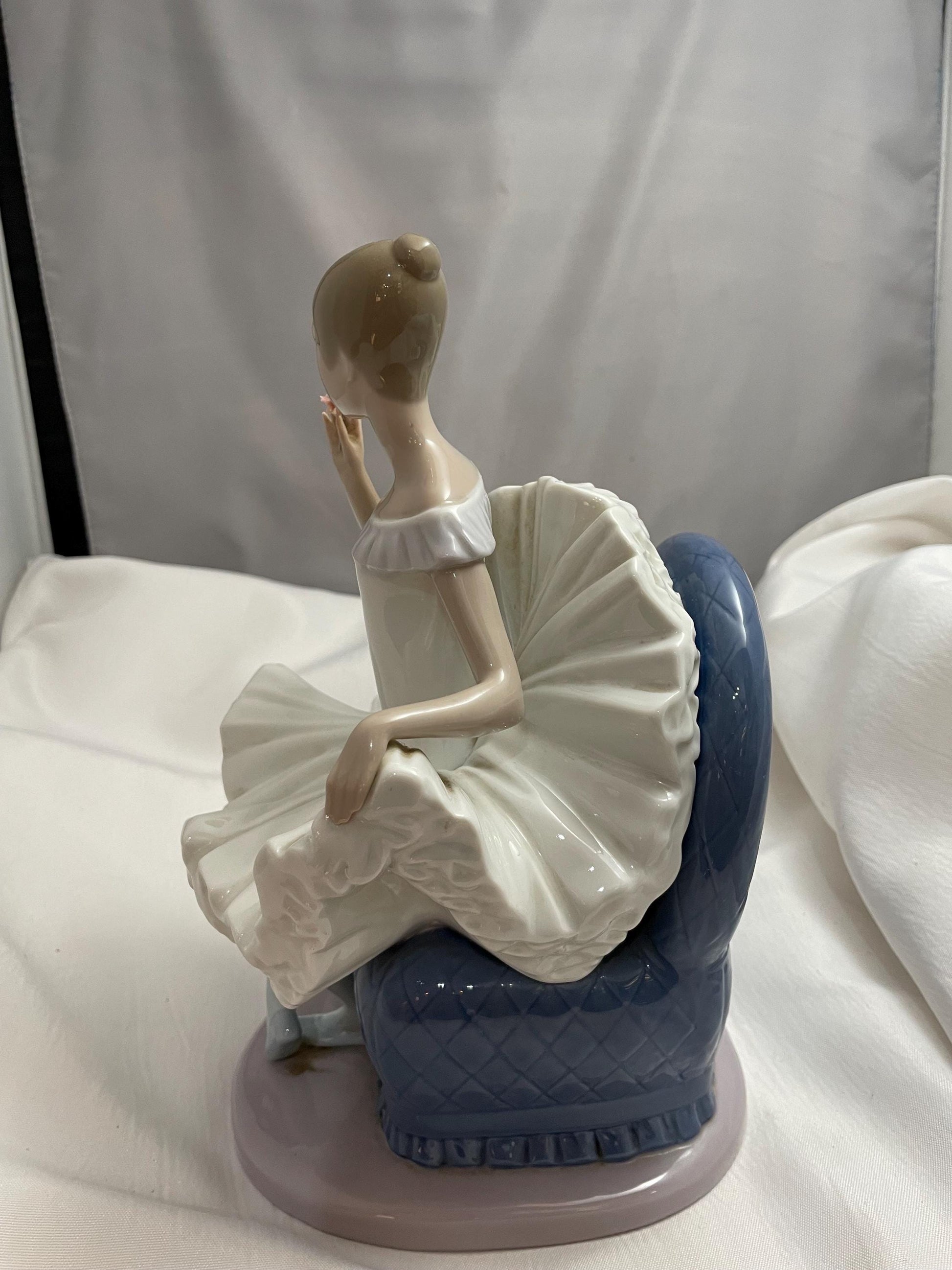 1983 Large Porcelain Lladro sitting Ballerina/Blue chair.