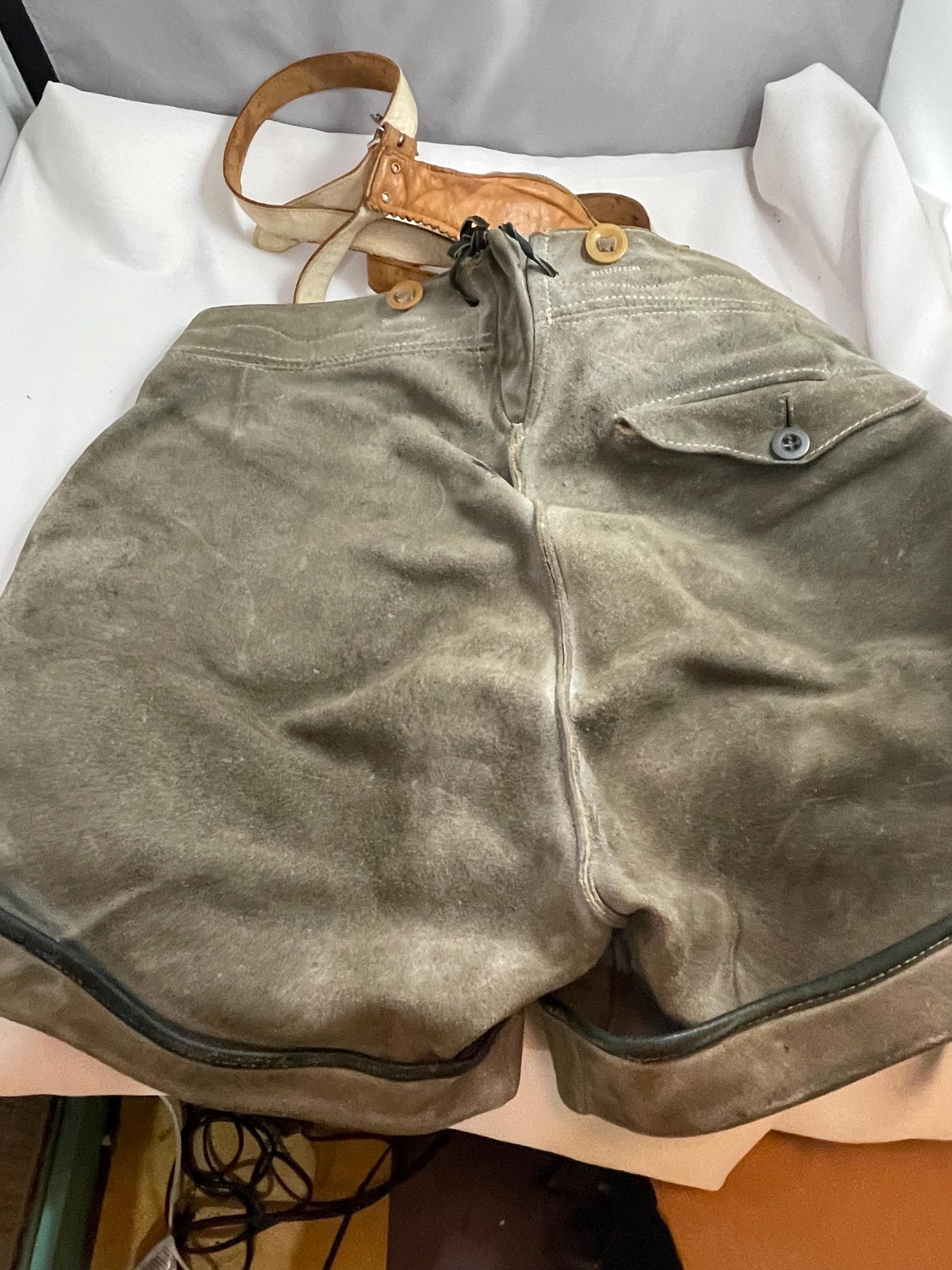 Vintage suede Lederhosen suspender shorts w/ 50’s-60’s Vintage Lederhosen Leather pants brace w/ zipper pocket and Deer Emblem.