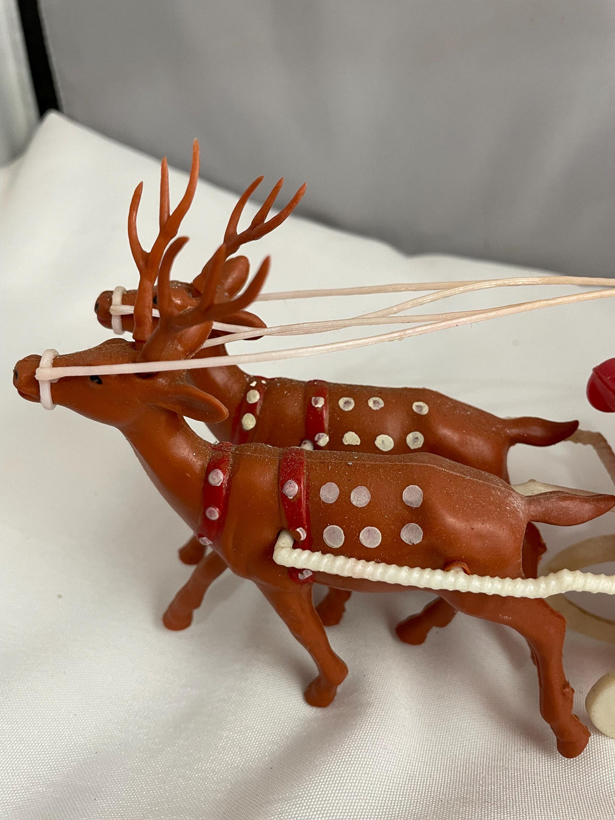 Vintage Plastic Santa claus With sled full of presents and his Reindeer Christmas decor.