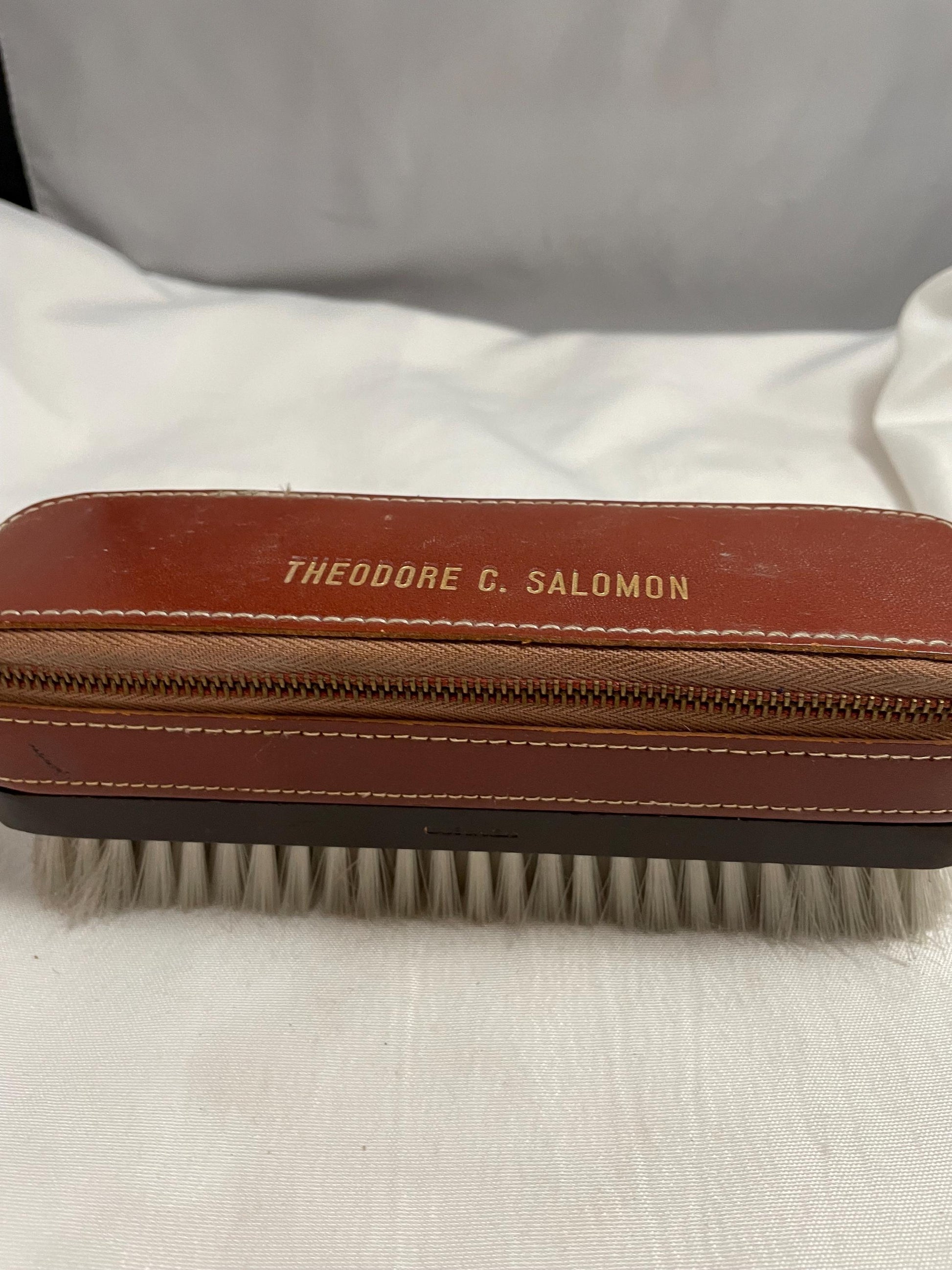 Vintage Theodore C. Salomon clothes/shoe brush W/ grooming accessories Leather zipped compartment.