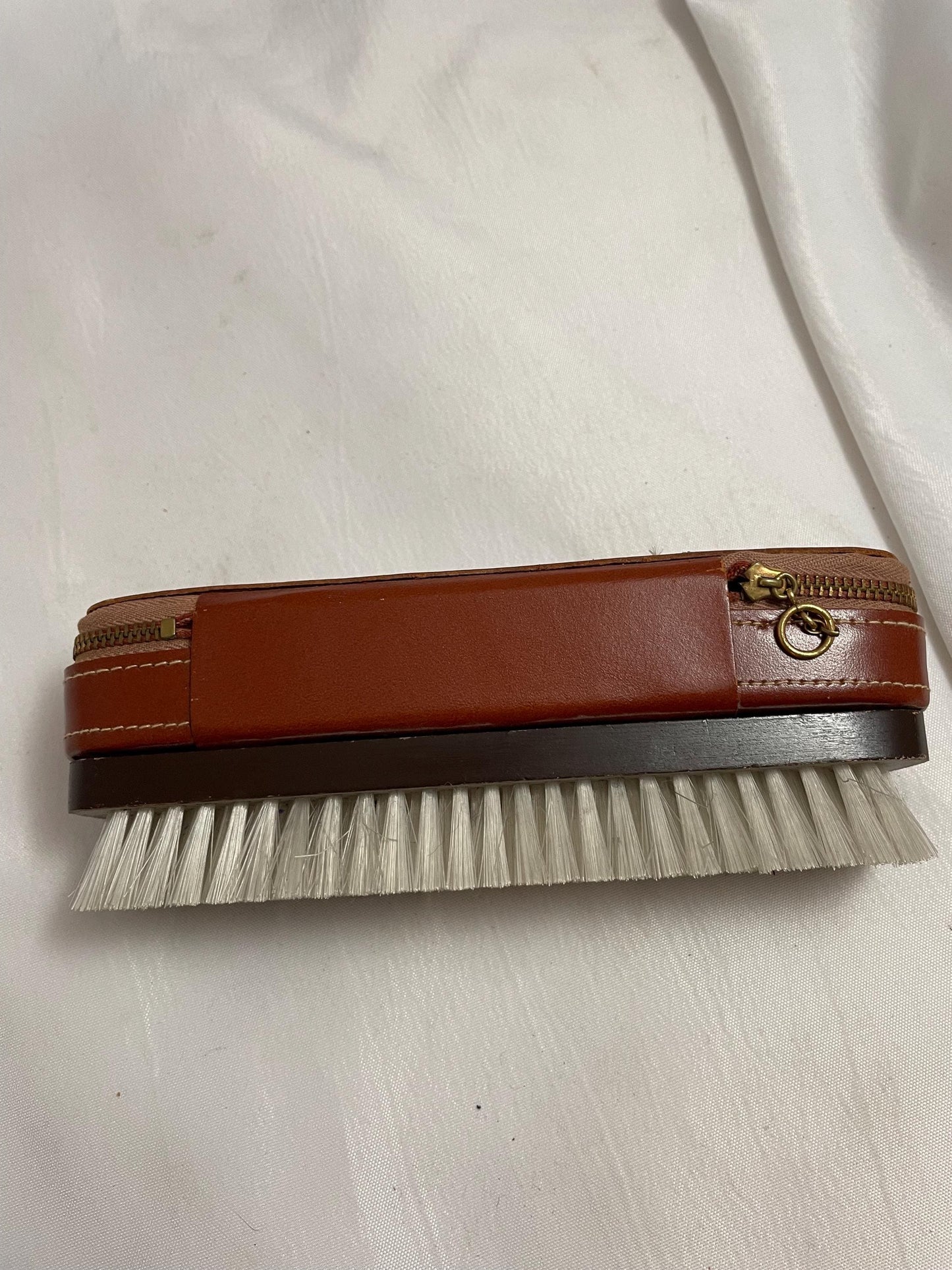 Vintage Theodore C. Salomon clothes/shoe brush W/ grooming accessories Leather zipped compartment.