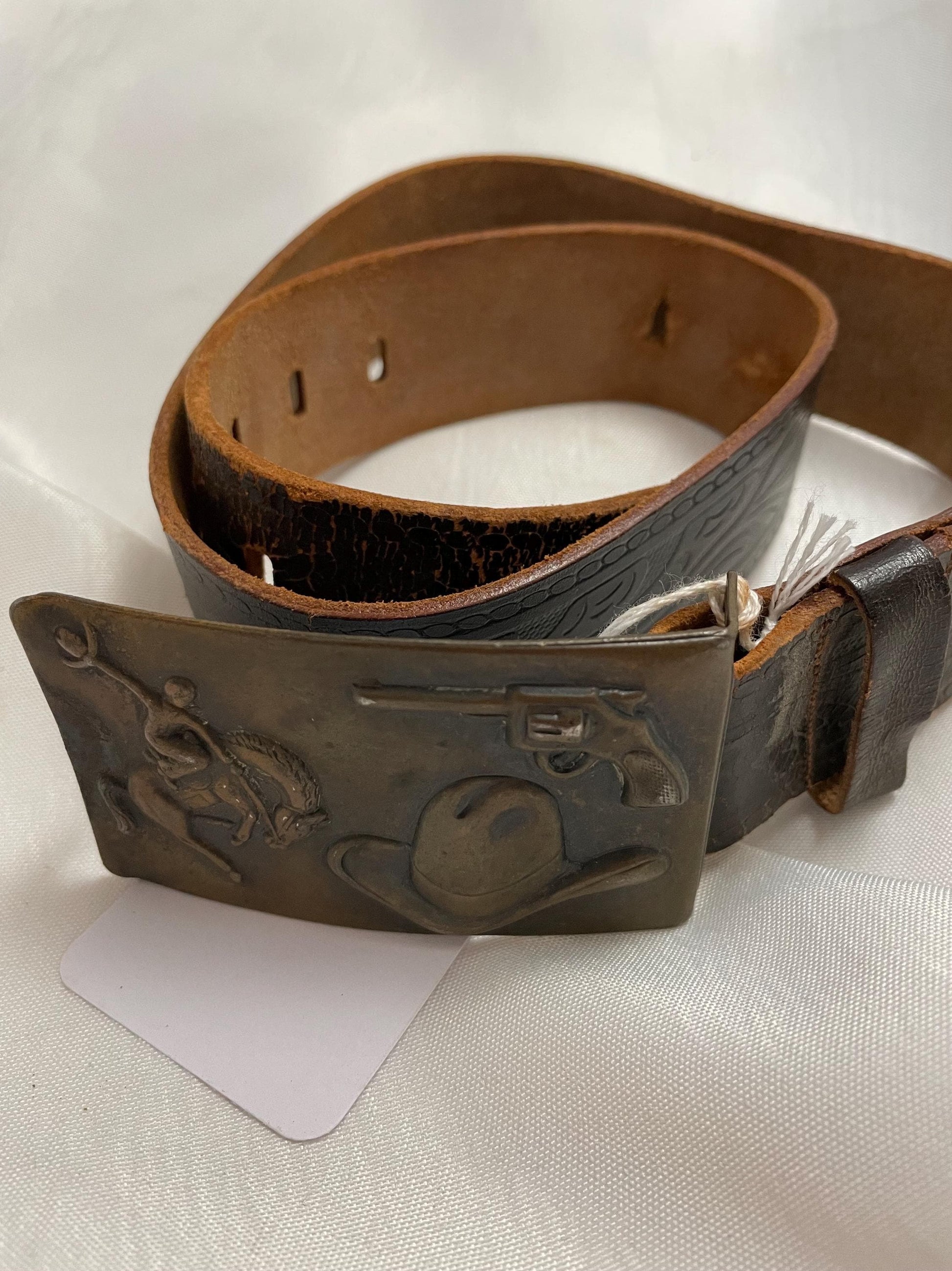 Old Vintage 1950’s small Leather Cowboy Belt w/ Buckle. Great pressed Back on buckle.