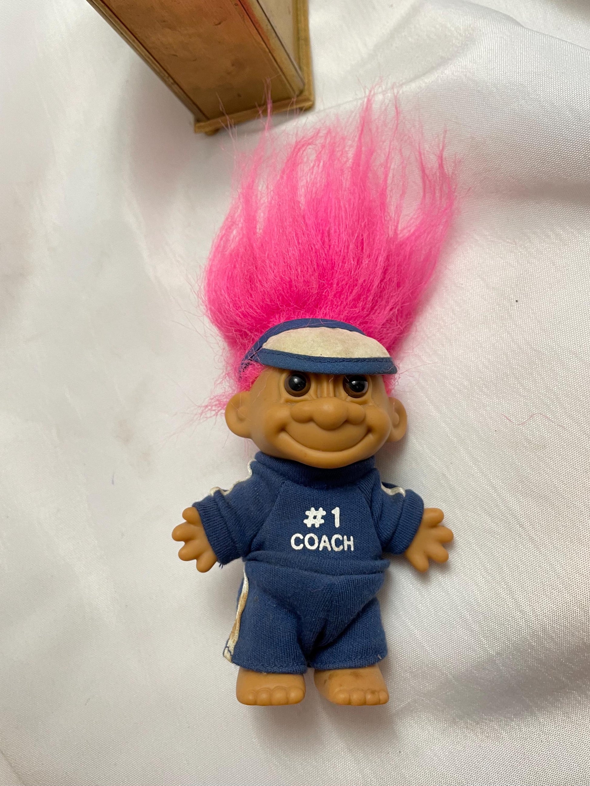 Russ Berrie #1 Coach w/track suit Troll Doll. Pink hair. 4 1/2”.