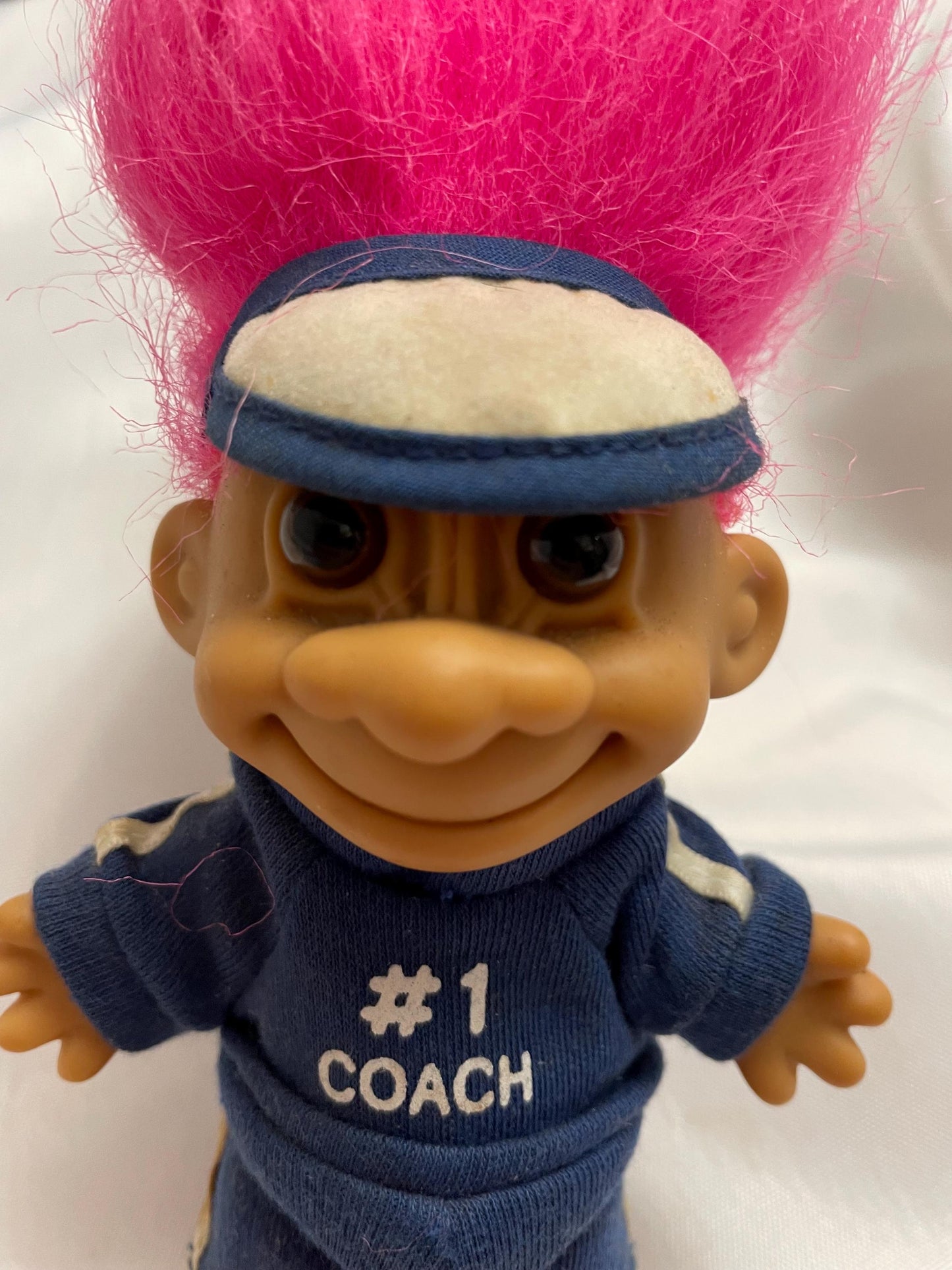 Russ Berrie #1 Coach w/track suit Troll Doll. Pink hair. 4 1/2”.