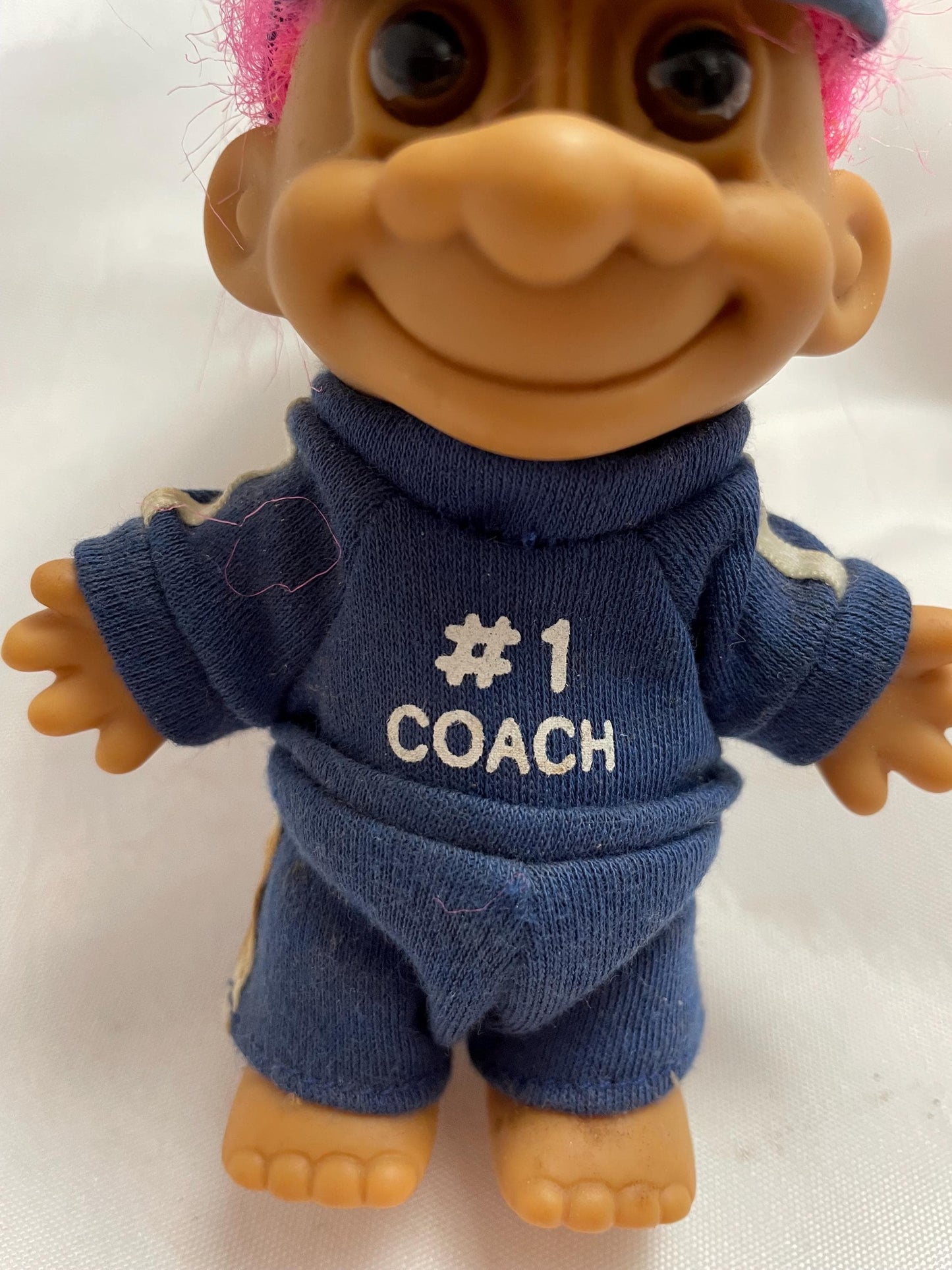 Russ Berrie #1 Coach w/track suit Troll Doll. Pink hair. 4 1/2”.