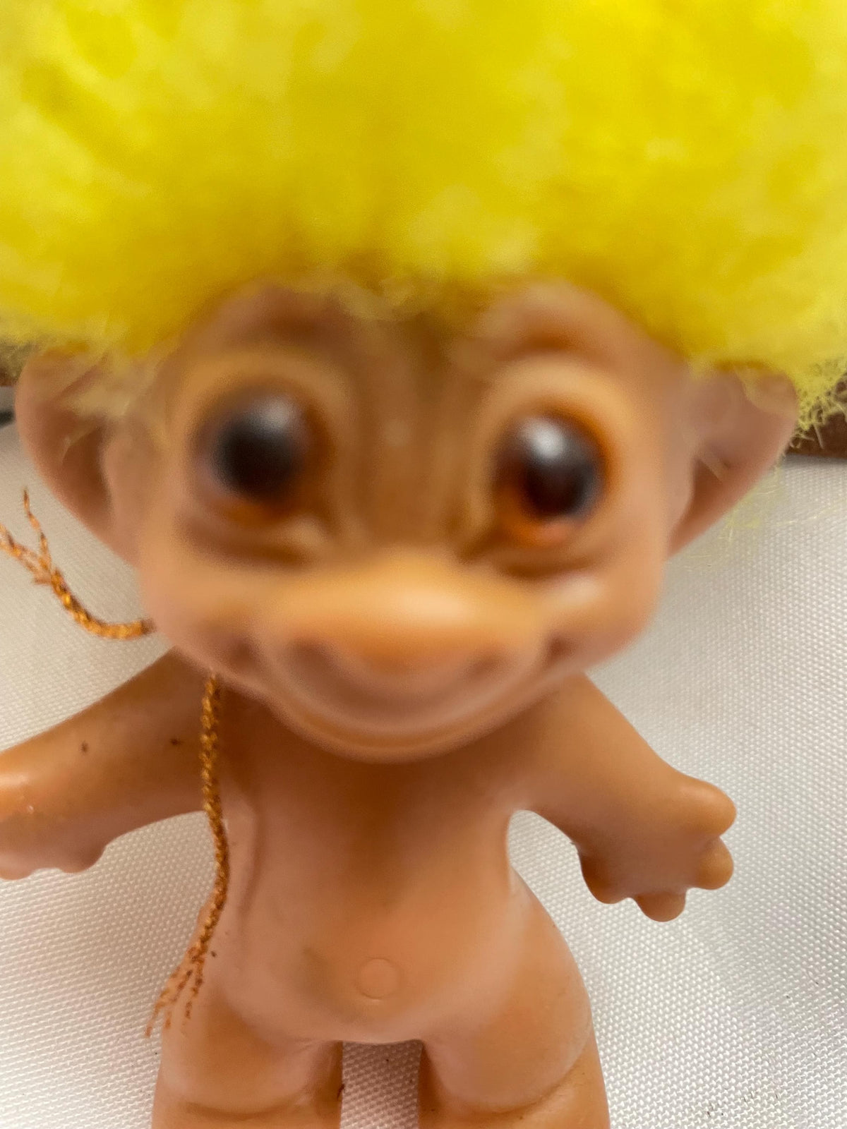 Vintage Russ Troll doll w/ Yellow hair. 3 1/2”.