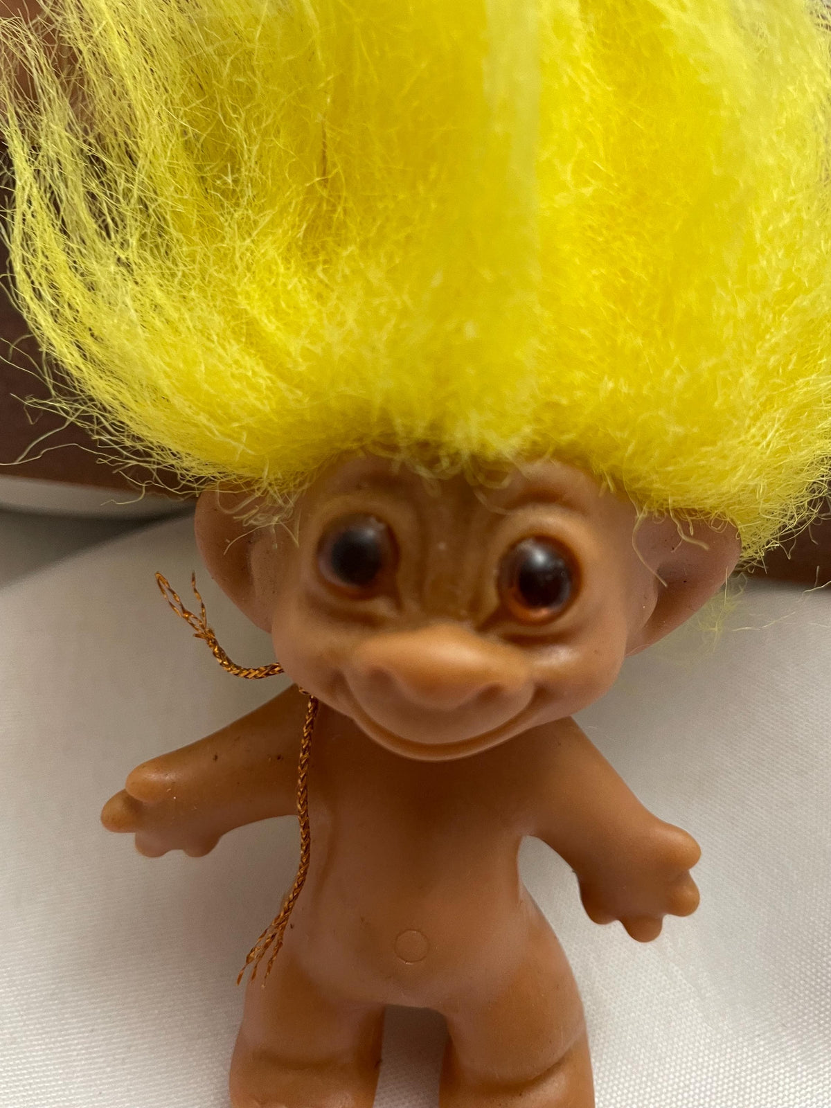 Vintage Russ Troll doll w/ Yellow hair. 3 1/2”.