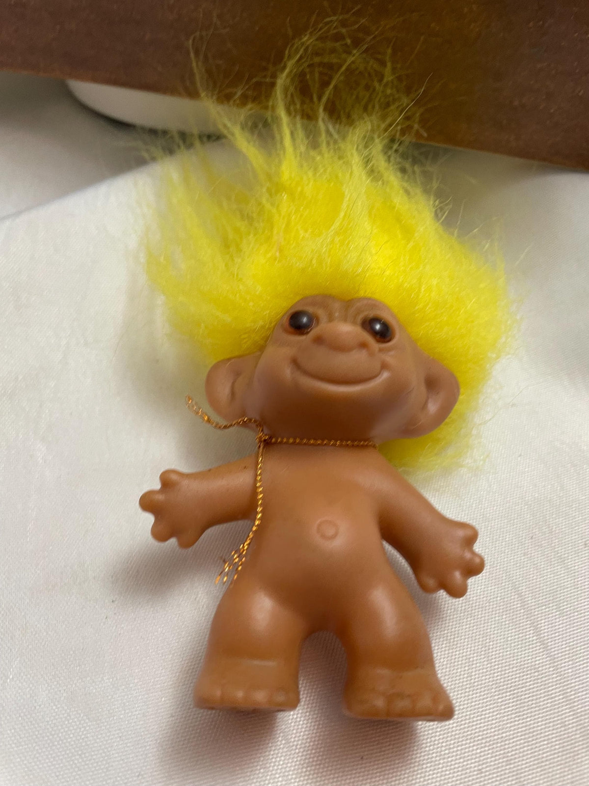Vintage Russ Troll doll w/ Yellow hair. 3 1/2”.
