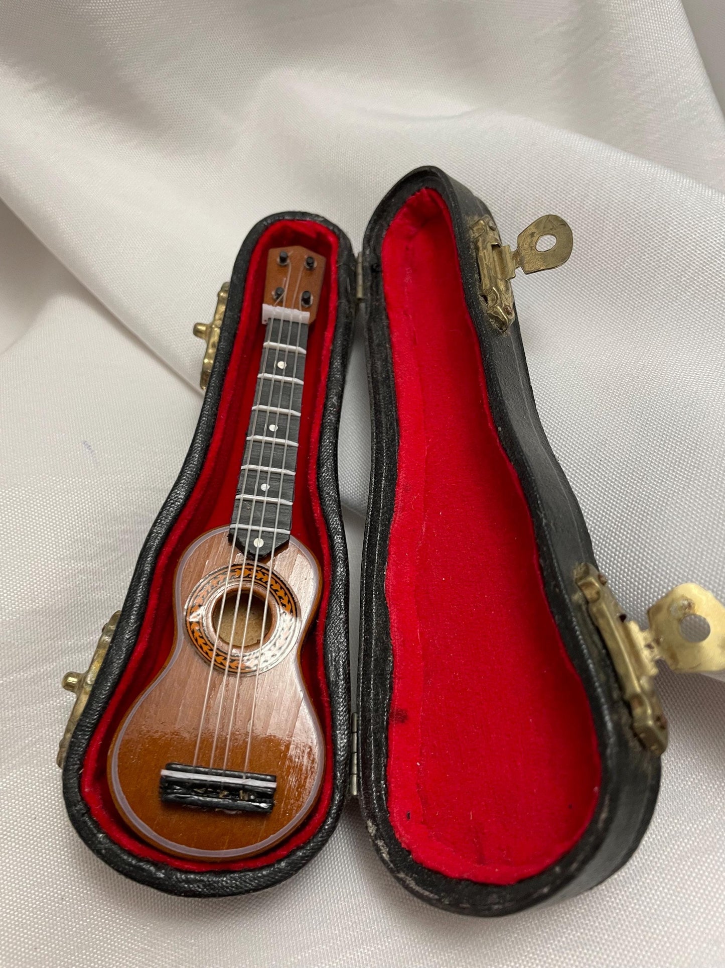 Miniature Replica of Acoustic Guitar in case.