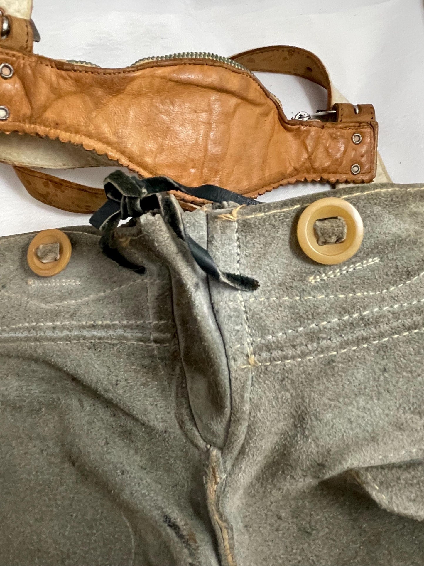 Vintage suede Lederhosen suspender shorts w/ 50’s-60’s Vintage Lederhosen Leather pants brace w/ zipper pocket and Deer Emblem.