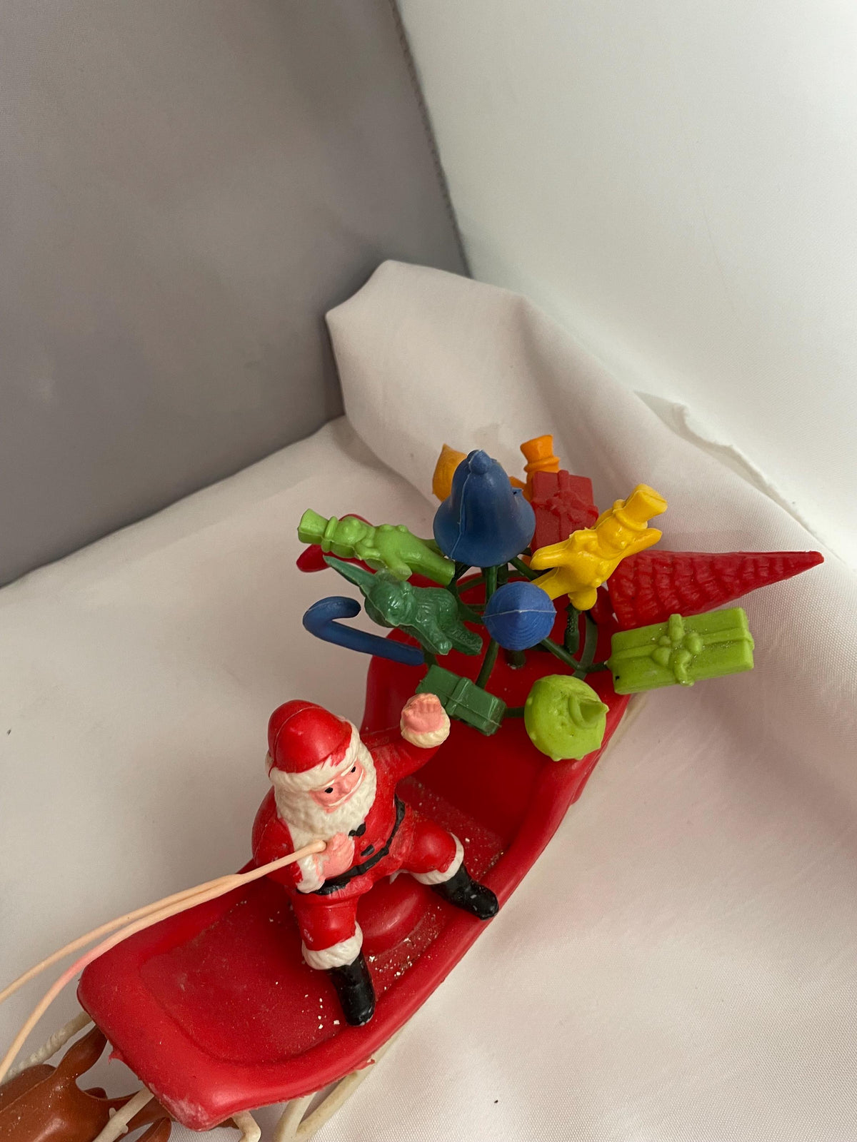 Vintage Plastic Santa claus With sled full of presents and his Reindeer Christmas decor.