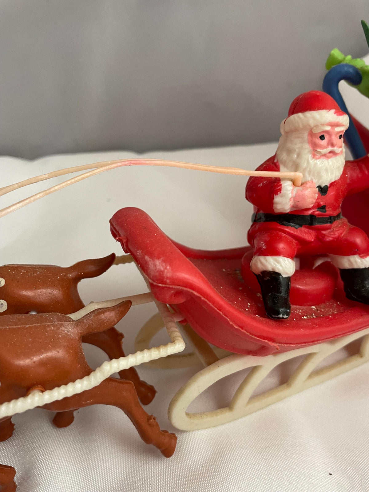 Vintage Plastic Santa claus With sled full of presents and his Reindeer Christmas decor.