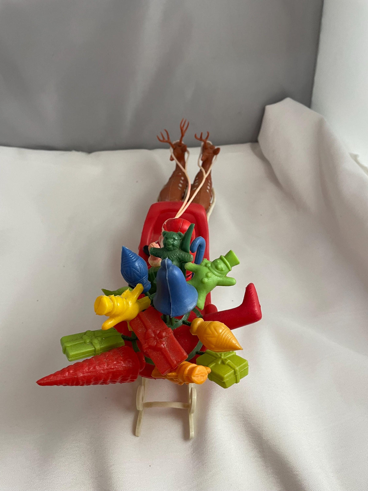 Vintage Plastic Santa claus With sled full of presents and his Reindeer Christmas decor.